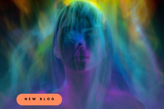 Neon-colored portrait with blue, purple, and green lighting; peach badge reads NEW BLOG, announcing a new post.
